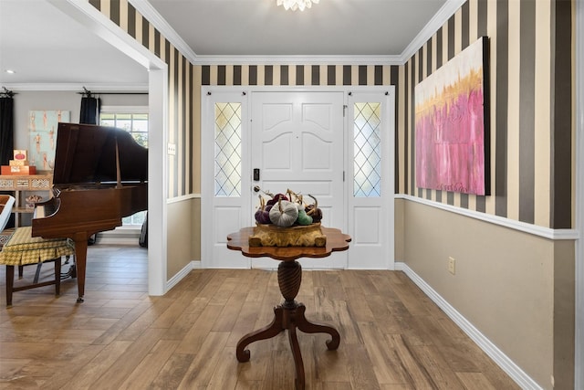 7117 Serrano Dr, Benbrook, TX 76126 - foyer with wallpapered walls, crown molding, baseboards, and wood finished floors