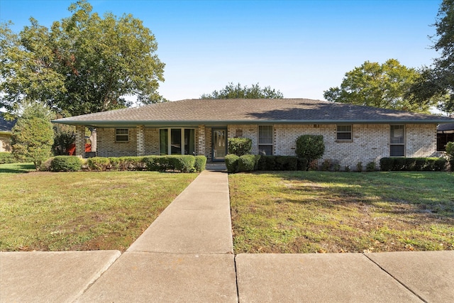 ranch-style house with a front lawn