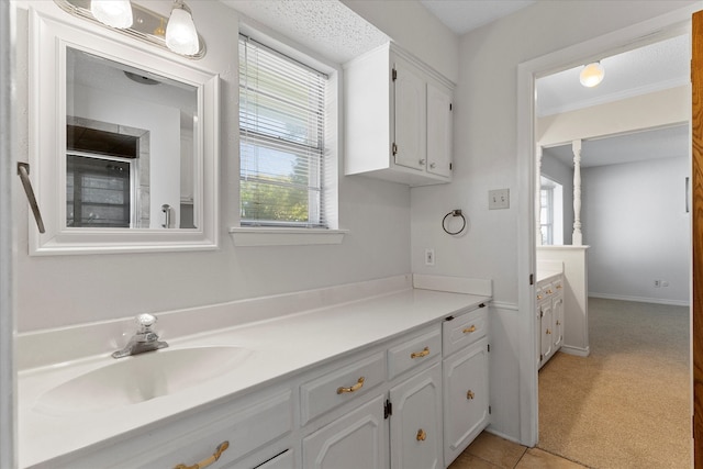 bathroom featuring vanity, a textured ceiling, and tile patterned floors