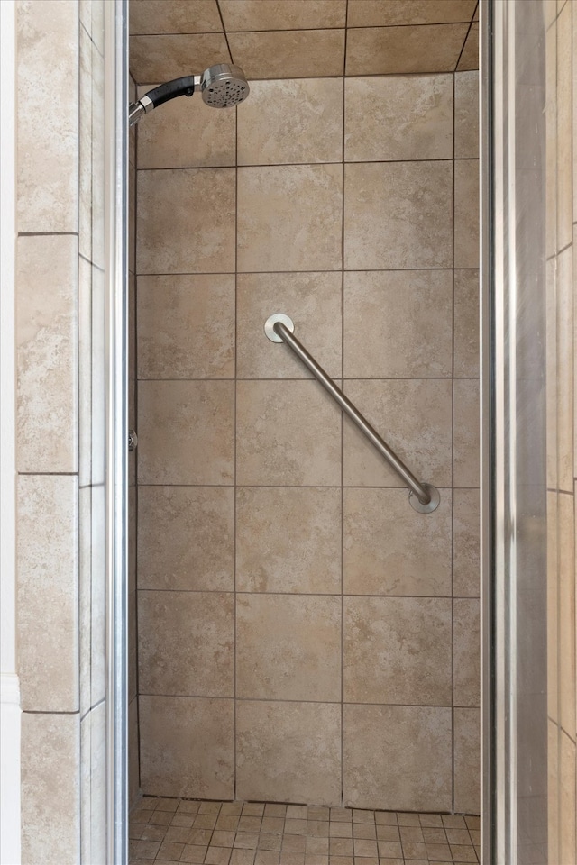 bathroom with tiled shower