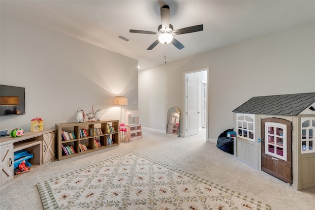 playroom with ceiling fan and light carpet