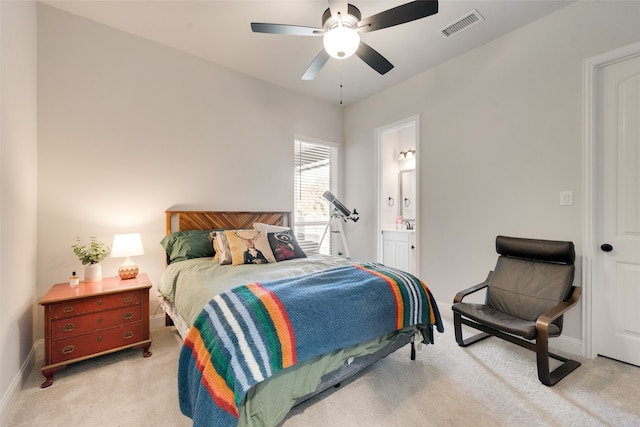 carpeted bedroom featuring ceiling fan and ensuite bathroom