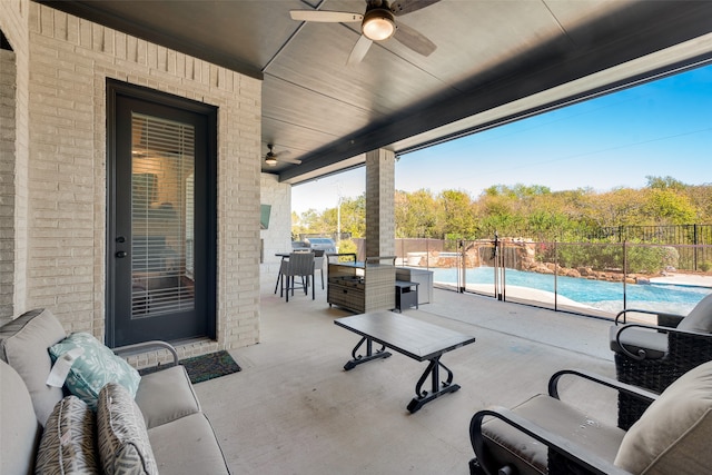 view of patio featuring ceiling fan and a fenced in pool