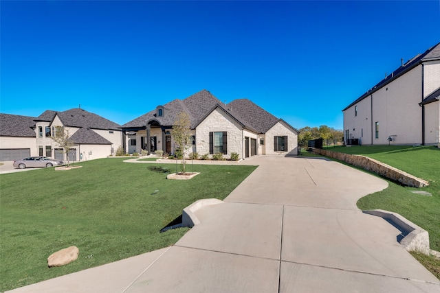 french provincial home with a front lawn