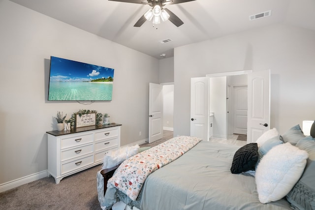 carpeted bedroom featuring vaulted ceiling and ceiling fan