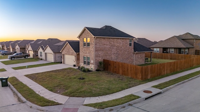 view of front of property featuring a lawn