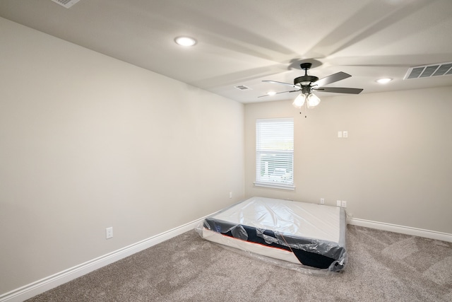 bedroom with ceiling fan and carpet