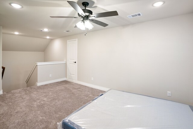 carpeted bedroom featuring lofted ceiling and ceiling fan