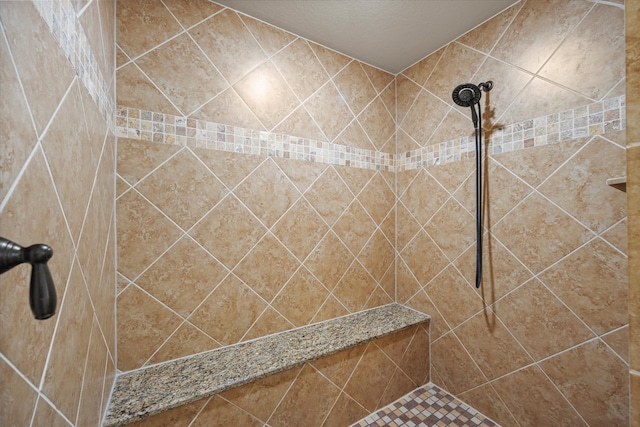 bathroom with tiled shower