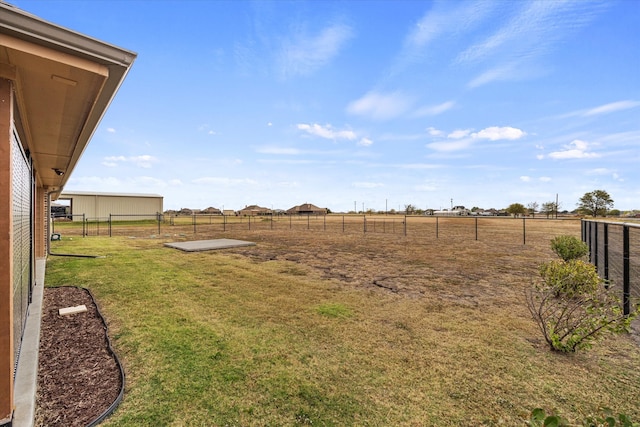 view of yard with a rural view