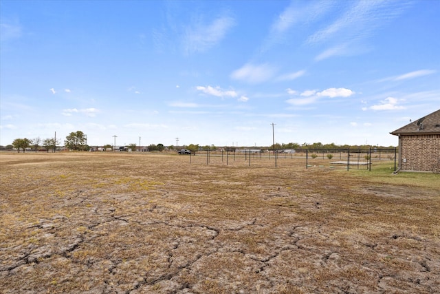 view of yard with a rural view