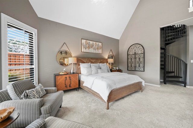 bedroom featuring high vaulted ceiling and carpet floors