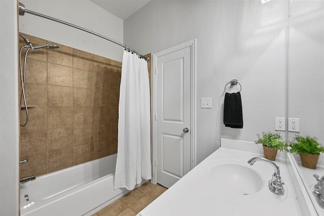 bathroom with tile patterned flooring, sink, and shower / bath combo with shower curtain