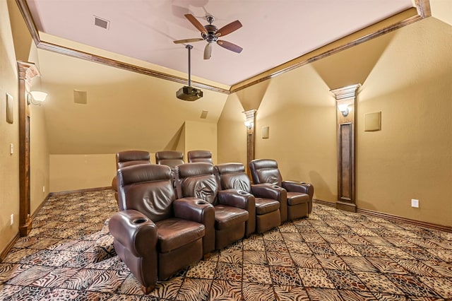 home theater featuring decorative columns, vaulted ceiling, ceiling fan, and carpet floors