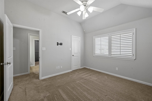 unfurnished bedroom featuring lofted ceiling, carpet flooring, and ceiling fan