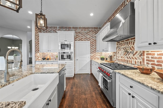 kitchen featuring appliances with stainless steel finishes, sink, and white cabinets