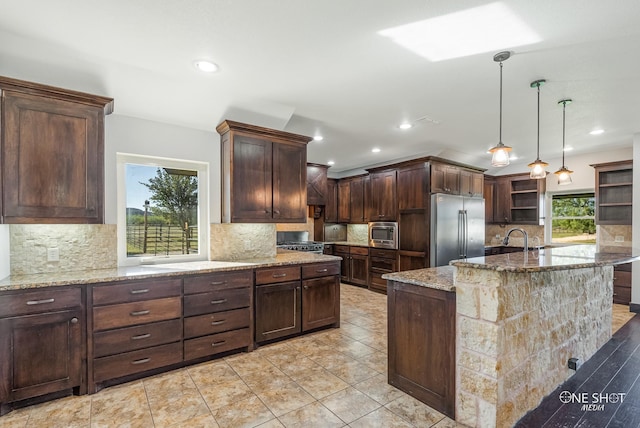 560 County Road 332, Abilene, TX 79606 - kitchen featuring high quality fridge, open shelves, light stone counters, decorative backsplash, and dark brown cabinetry