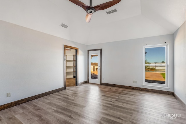 560 County Road 332, Abilene, TX 79606 - empty room with wood finished floors, baseboards, a ceiling fan, and vaulted ceiling