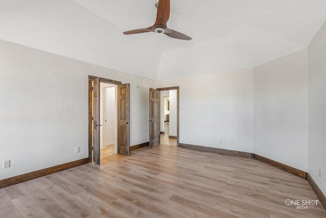 unfurnished bedroom with ceiling fan, light wood-type flooring, and lofted ceiling