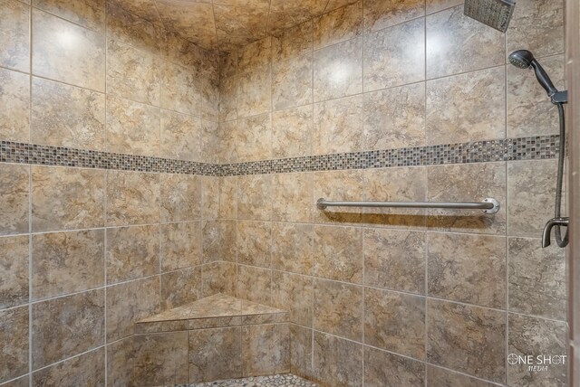 bathroom with tiled shower