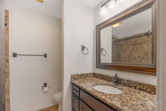 560 County Road 332, Abilene, TX 79606 - full bathroom featuring toilet, vanity, and baseboards
