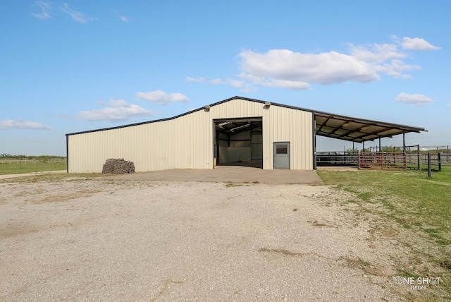 view of outdoor structure with a rural view