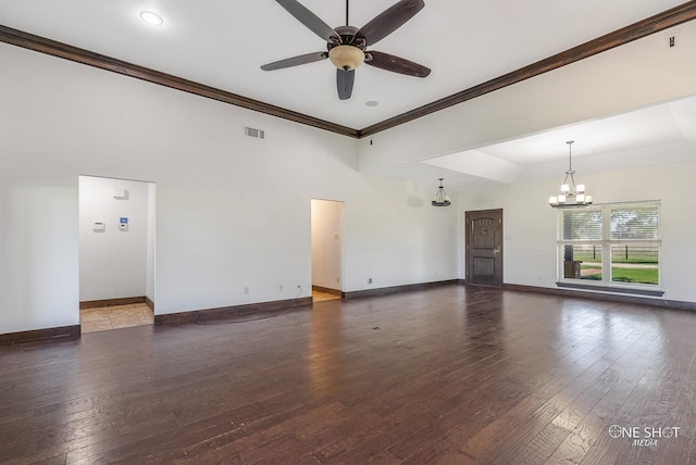 unfurnished living room featuring ceiling fan with notable chandelier, dark hardwood / wood-style flooring, and ornamental molding