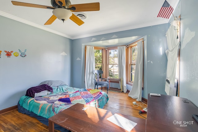 bedroom with ceiling fan, crown molding, and wood-type flooring