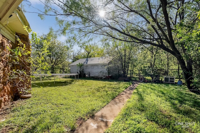 view of yard featuring a trampoline