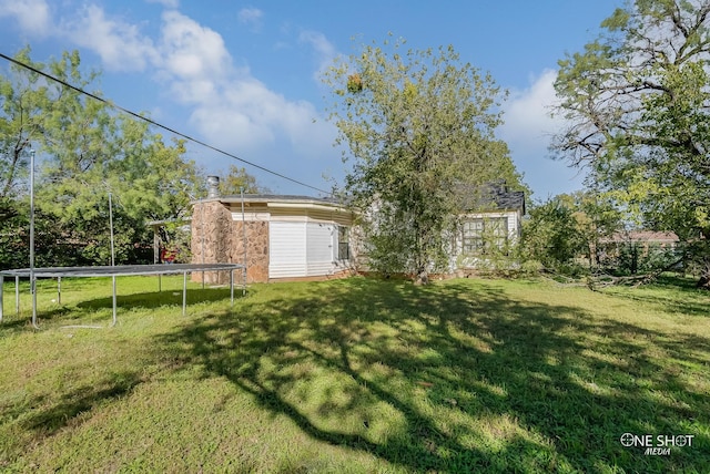 view of yard with a trampoline