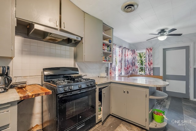 kitchen featuring ceiling fan, tasteful backsplash, wooden counters, kitchen peninsula, and black range with gas cooktop