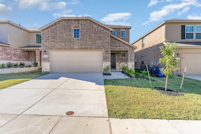 front facade with a garage and a front yard