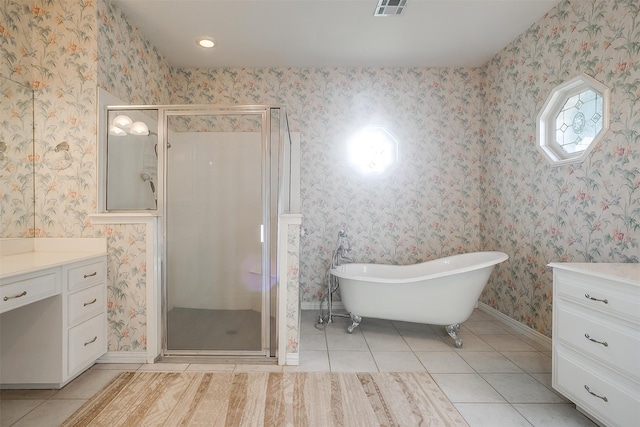 bathroom with shower with separate bathtub, vanity, and tile patterned floors