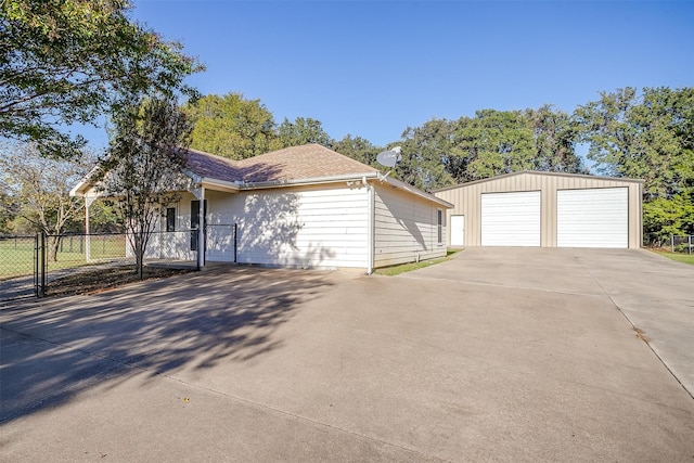 view of front facade with an outbuilding and a garage