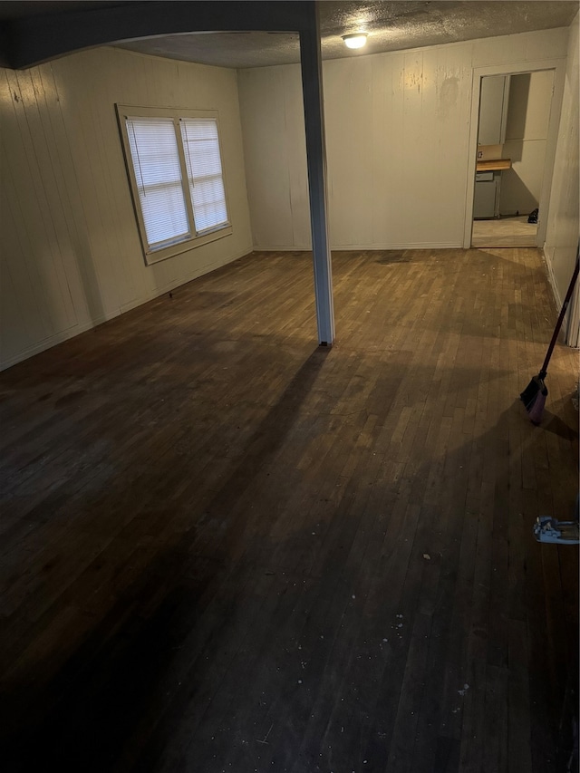 basement featuring dark wood-type flooring