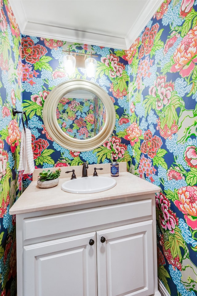 bathroom with ornamental molding and vanity