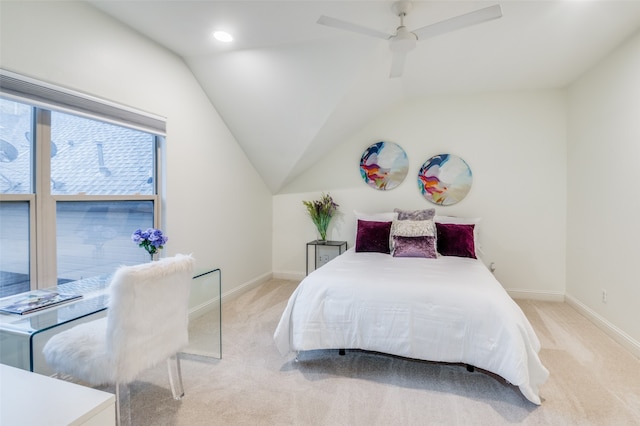 bedroom with light colored carpet, lofted ceiling, and ceiling fan