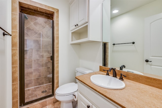 bathroom featuring vanity, tile patterned floors, toilet, and a shower with door