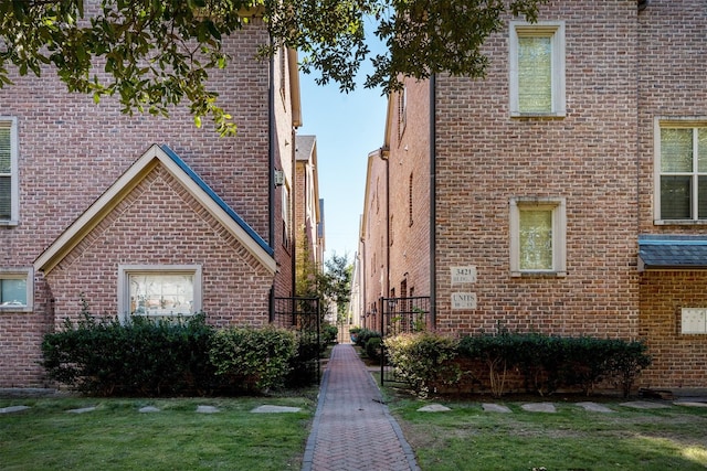 view of property exterior with a lawn