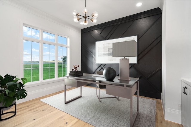 office space with light wood-type flooring, a chandelier, and ornamental molding