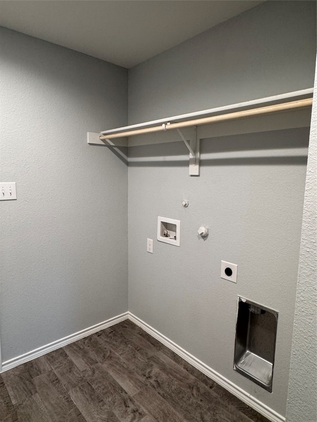 washroom featuring hookup for an electric dryer, washer hookup, dark hardwood / wood-style flooring, and hookup for a gas dryer