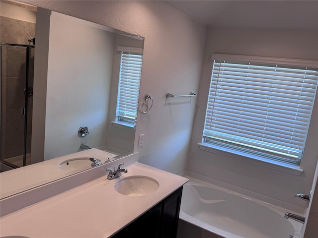 bathroom featuring vanity and plus walk in shower