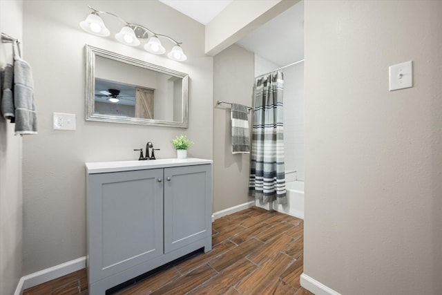 bathroom featuring vanity, hardwood / wood-style flooring, and shower / tub combo