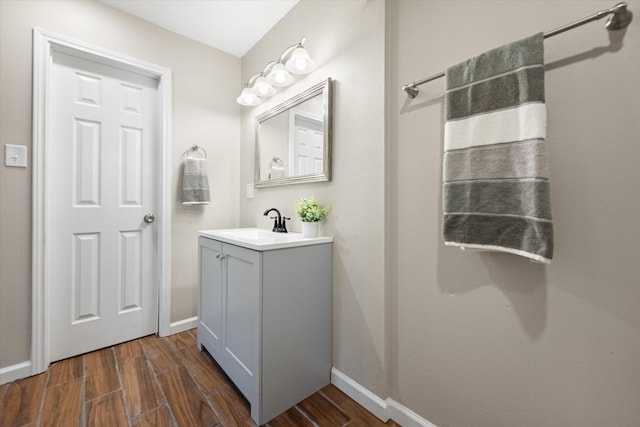 bathroom featuring vanity and hardwood / wood-style flooring