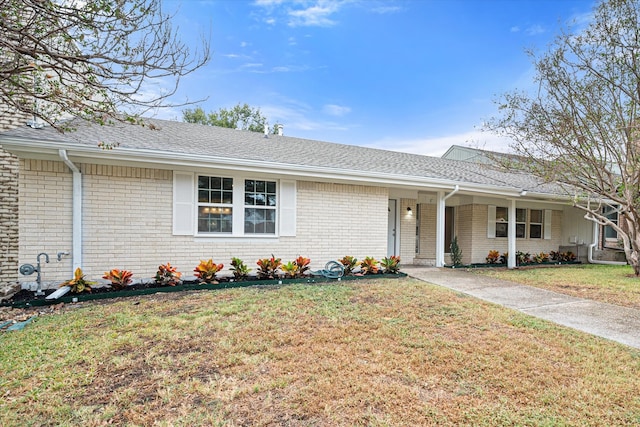 ranch-style home with a front yard