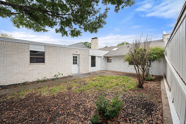 back of property with a patio area