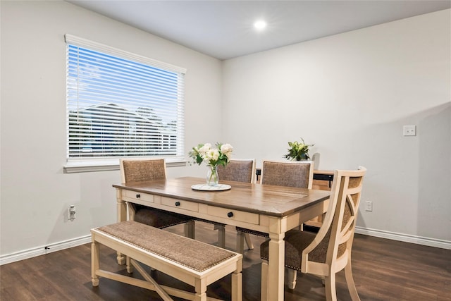 dining room with dark hardwood / wood-style flooring