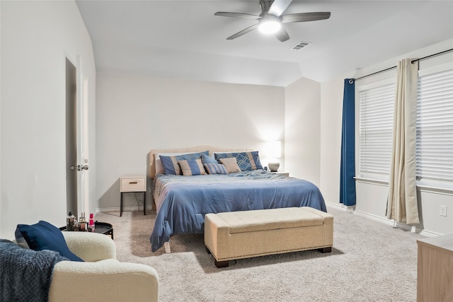 bedroom with lofted ceiling, light carpet, and ceiling fan