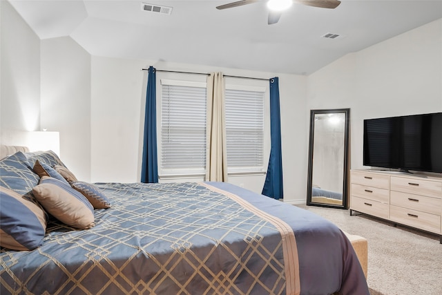 bedroom featuring light carpet, ceiling fan, and vaulted ceiling