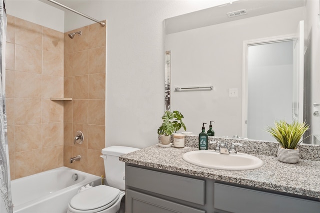 full bathroom with vanity, shower / bath combo with shower curtain, and toilet